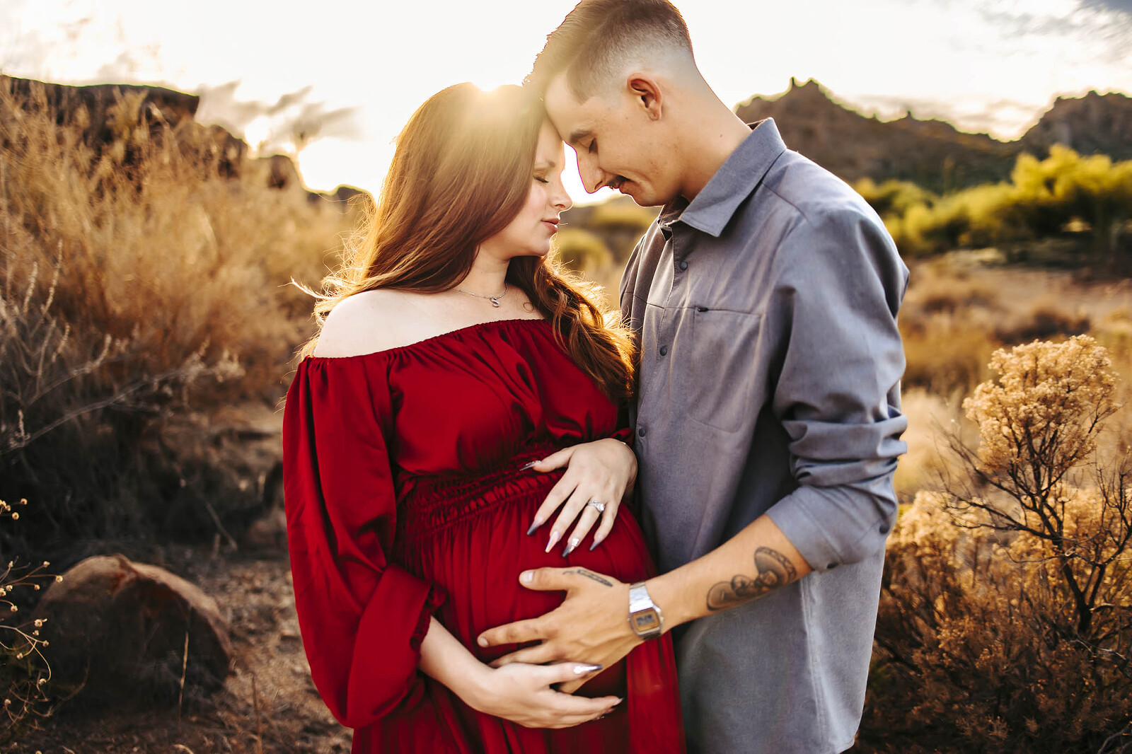 couple poses for maternity photoshoot in scottsdale arizona