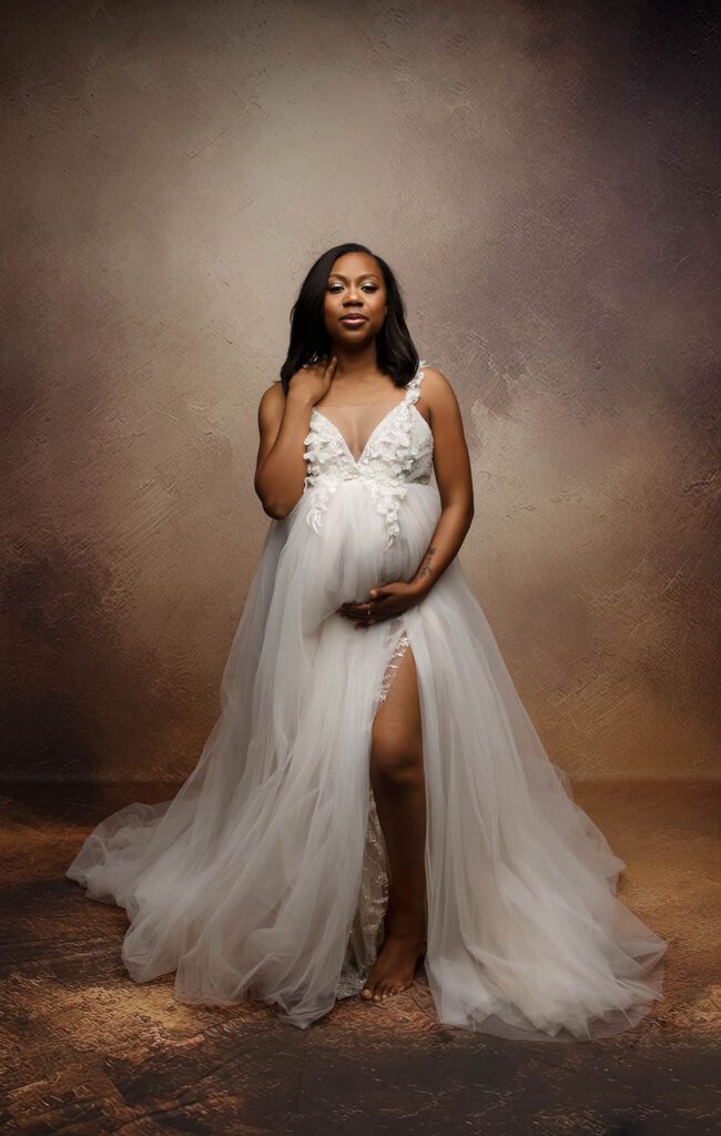 studio maternity photo with white gown