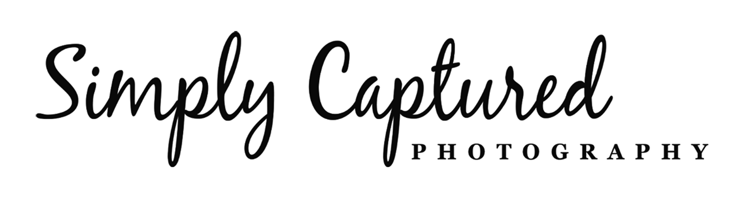 Black script text reads "Simply Captured" with "PHOTOGRAPHY" in uppercase serif font underneath, on a light background—perfect for a family photographer Phoenix AZ specializing in timeless moments.